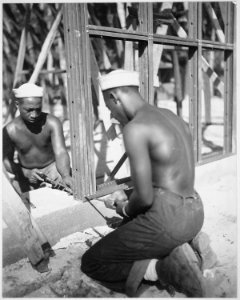 Construction of the prefabricated steel storage warehouse (by members of the 34th Construction Bn.) at Halavo Seaplane - NARA - 520629