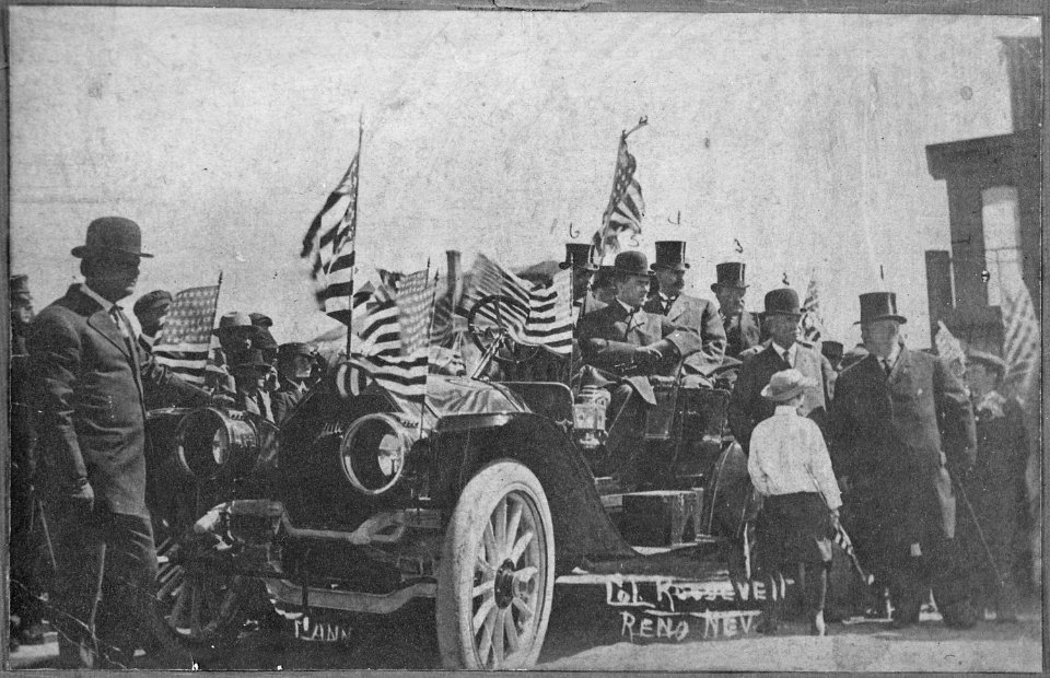 Col. Roosevelt, Reno, Nev. Campaigning from an open touring car decorated with American flags, ca. 1912. Theodore Roos - NARA - 559373