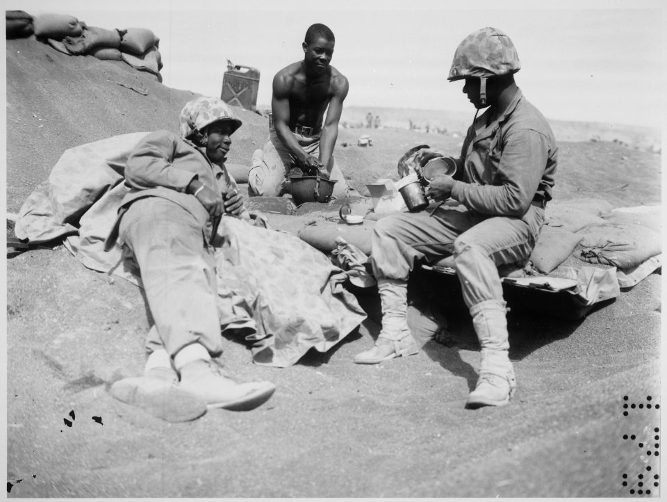 Iwo Jima...Negro Marines on the beach at Iwo Jima are, from left to right, Pfcs. Willie J. Kanody, Elif Hill, and John - NARA - 532546