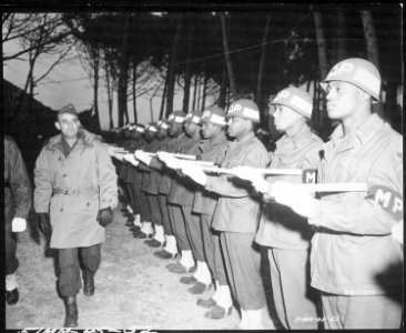 Lt. Gen. Joseph T. McNarney, Deputy Supreme Allied Commander, Mediterranean Theater, inspects Honor Guard of MPs during - NARA - 531415