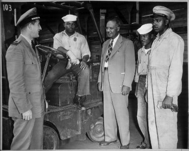 Lester Granger, while inspecting facilities for Negro personnel at NAS, San Diego, CA, stops to chat with Rofes Herring - NARA - 520687