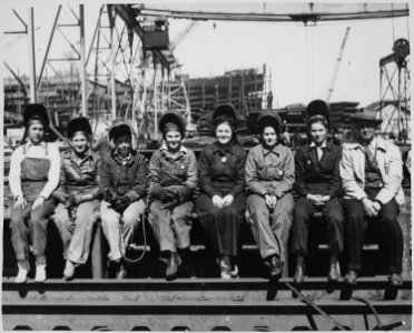 Line up of some of women welders including the women's welding champion of Ingalls (Shipbuilding Corp., Pascagoula, MS) - NARA - 522890 photo