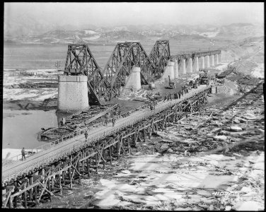Freedom Gate Bridge spanning the Imjin River, built by the 84th Engineer Construction Battalion This bridge... - NARA - 531427