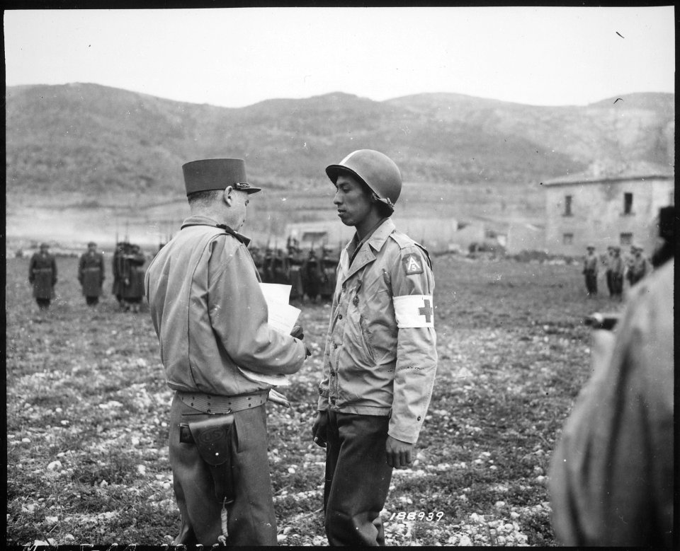 Pvt. Jonathan Hoag...of a chemical battalion, is awarded the Croix de Guerre by General Alphonse Juin, Commanding Gene - NARA - 531182