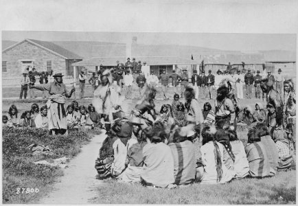 Shoshone Indians at Ft. Washakie, Wyoming Indian reservation .. . Chief Washakie (at left) extends his right arm, 1892 - NARA - 530919 photo