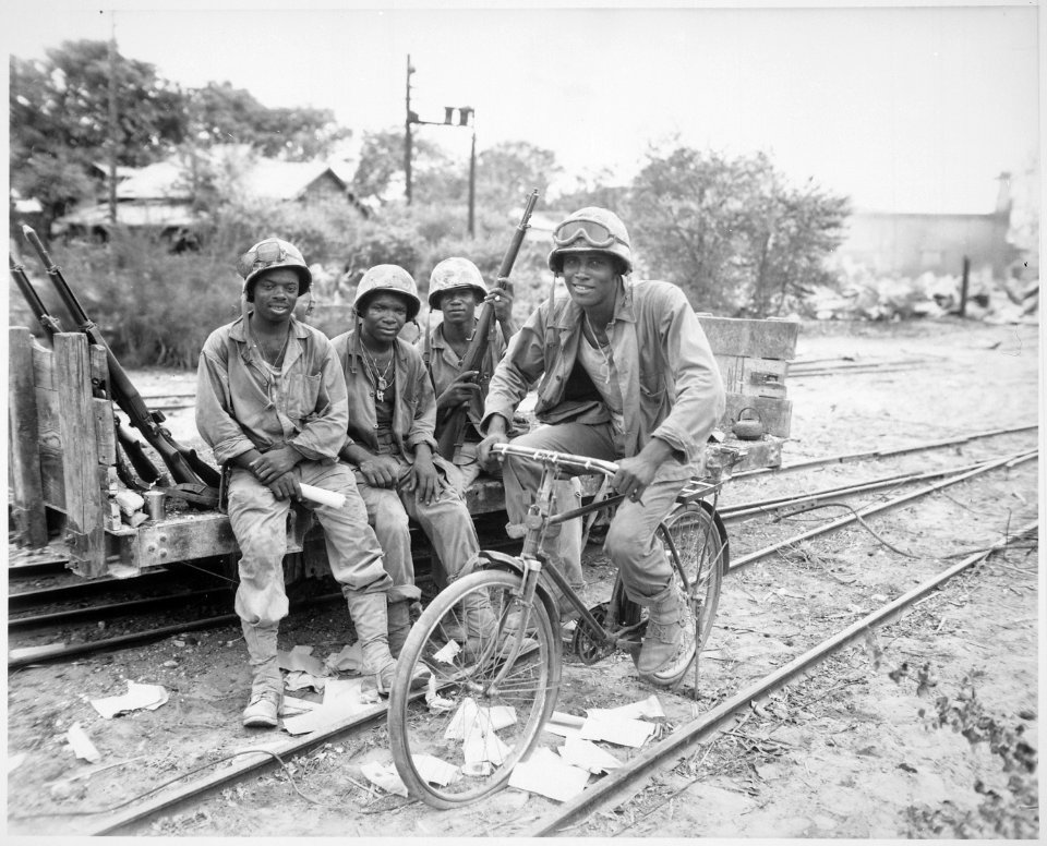 Negro Marines, attached to the Third Ammunition Company, take time out from supplying ammunition to the front line on S - NARA - 532531