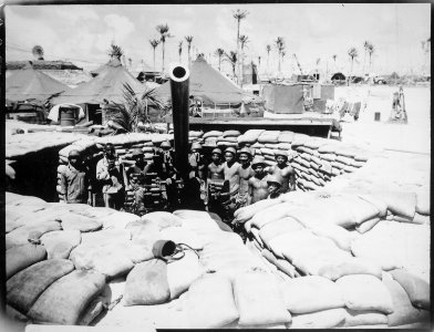 Surrounded by a veteran crew of Marines who have spent 15 months in the Southwest and Central Pacific, this gun, named - NARA - 532556
