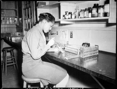 Pfc. Johnnie Mae Welton, Negro WAC, laboratory technician trainee, conducts an experiment in the serology laboratory sf - NARA - 531360 photo