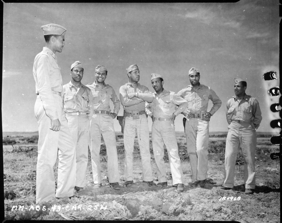 Staff officers of an...Air Corp Squadron near Fez, French Morocco. Left to right, Lt. Col. Benjamin O. Davis, C.O., Cap - NARA - 531174