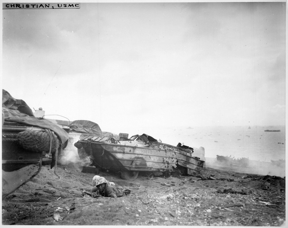 Two Negro duck (DUKW) drivers turn riflemen after their vehicle is destroyed., 02-19-1945 - NARA - 532545