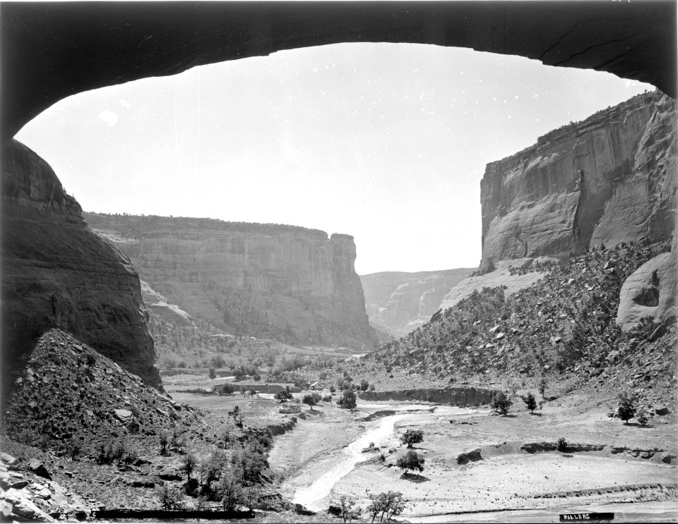 (Old No. 121) Gateway in De Chelly Canyon, Apache County, Arizona. A very small figure of a man in - NARA - 517769