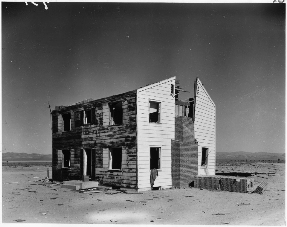 (Operation Cue) - Two-story wood frame house at 5,500 feet after the blast - NARA - 541788