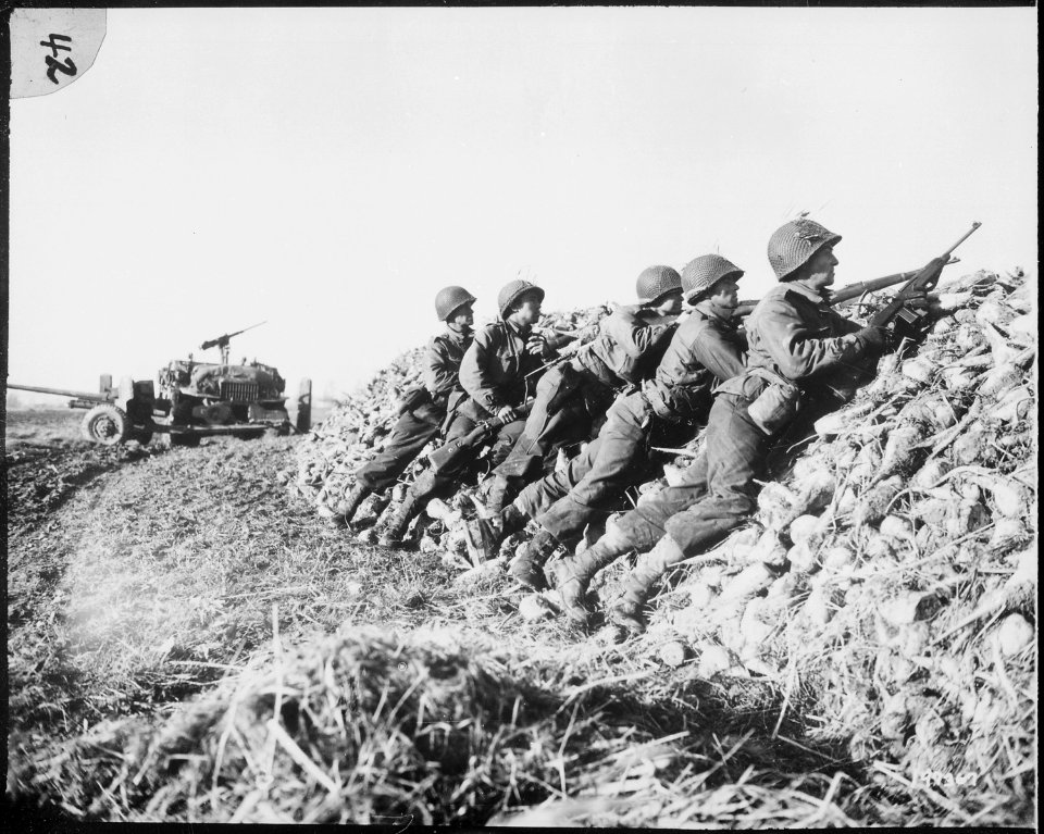 A U.S. Infantry anti-tank crew fires on Nazis who machine-gunned their vehicle, somewhere in Holland. - NARA - 531226