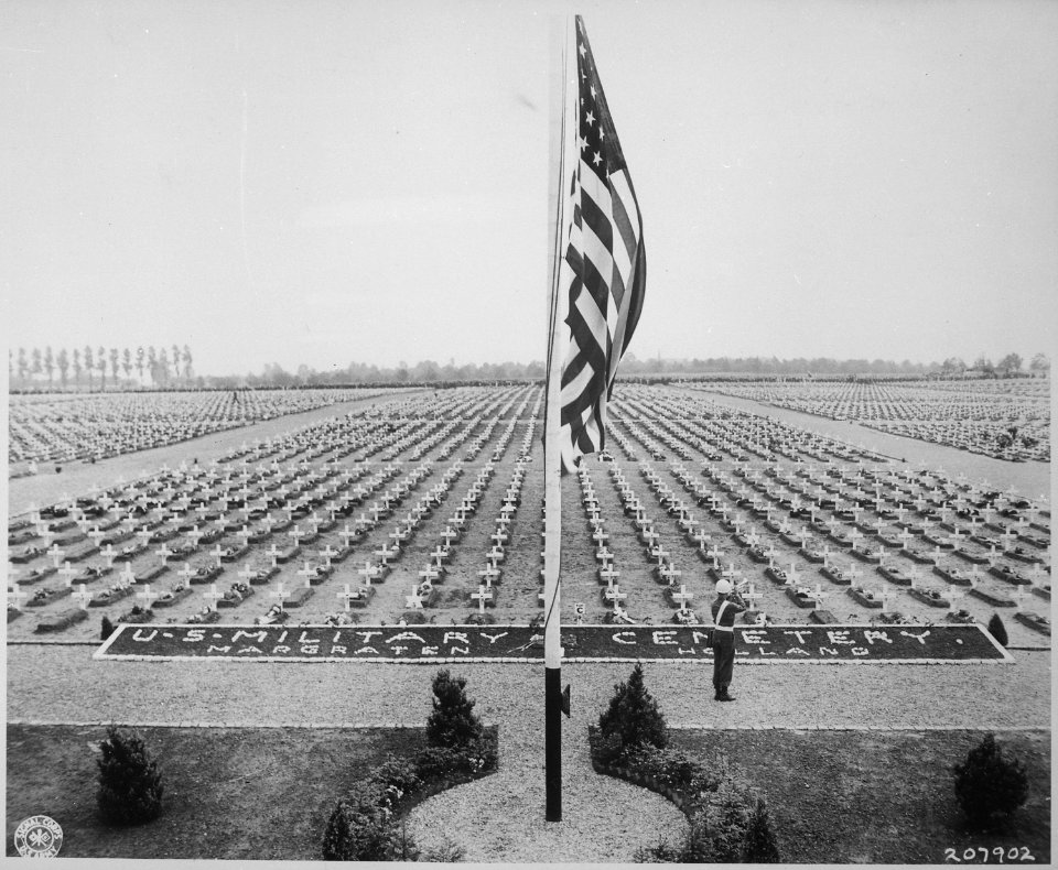 A bugler blows taps at the close of Memorial Day service at Margraten Cemetery, Holland, where lie thousands of... - NARA - 531299