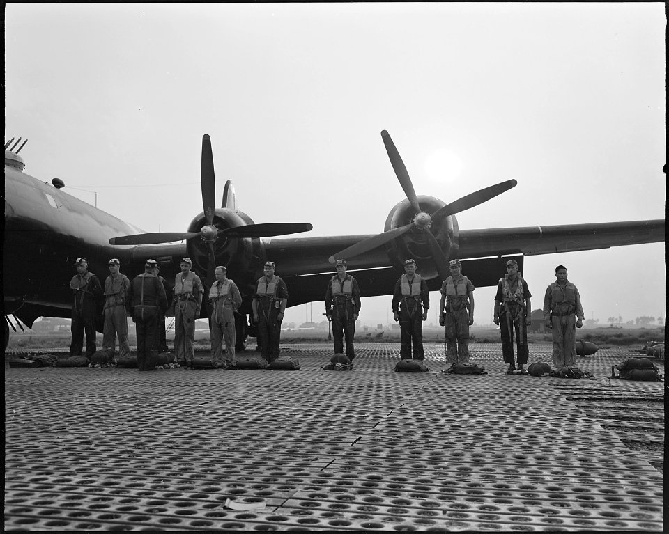 A Japan-based Superfort crew in the last hour of sunlight completes its inspection of emergency equipment. As the... - NARA - 542287
