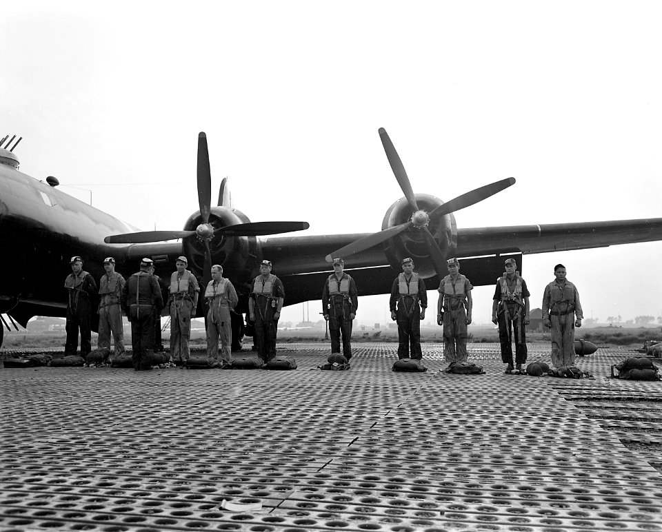 A Japan-based Superfort crew in the last hour of sunlight completes its inspection of emergency equipment. As the... - NARA - 542287