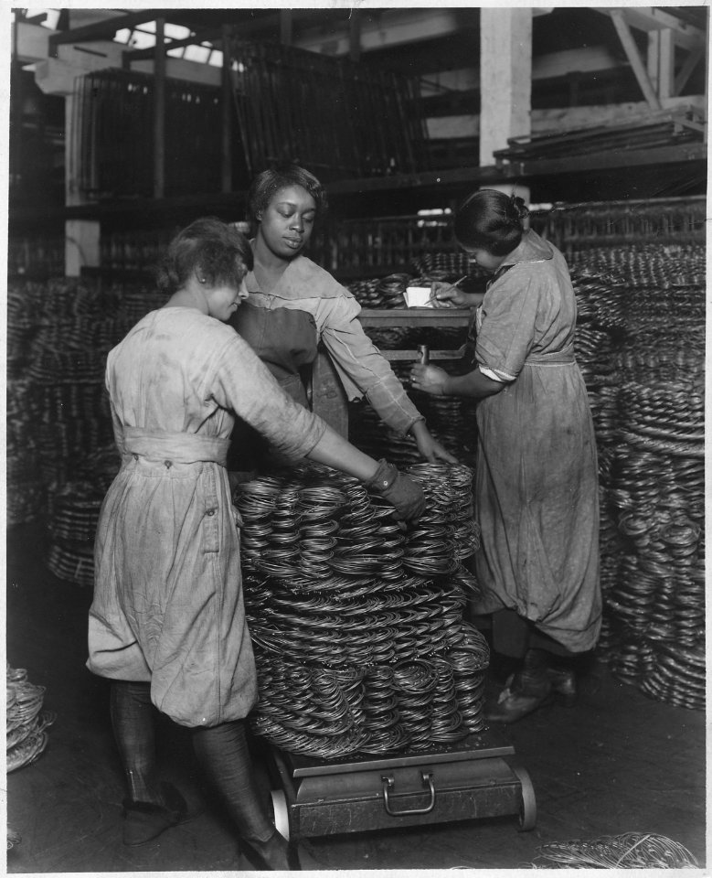 African-American women weighing wire coils and recording weights, to establish wage rates - NARA - 522865