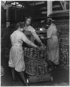 African-American women weighing wire coils and recording weights, to establish wage rates - NARA - 522865 photo