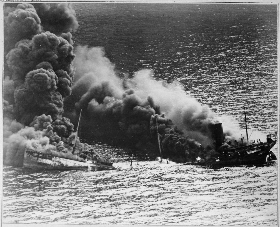 Allied tanker torpedoed in Atlantic Ocean by German submarine. Ship crumbling amidship under heat of fire, settles... - NARA - 520607
