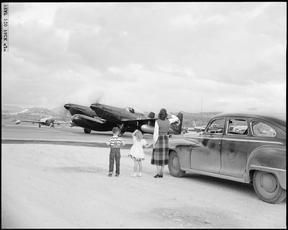 AIR WAR IN KOREA. A fond farewell from his family, sends Capt. Johnnie Gosnell of Borger, Texas, off on another... - NARA - 542207