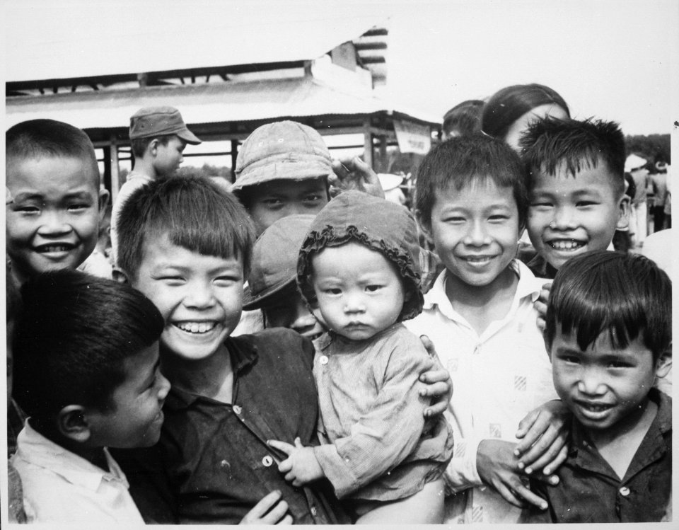 A new market for Tinh Thuong. Children gather before the market which was built with assistance from the government of - NARA - 541851