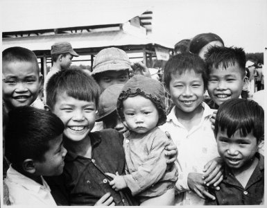 A new market for Tinh Thuong. Children gather before the market which was built with assistance from the government of - NARA - 541851
