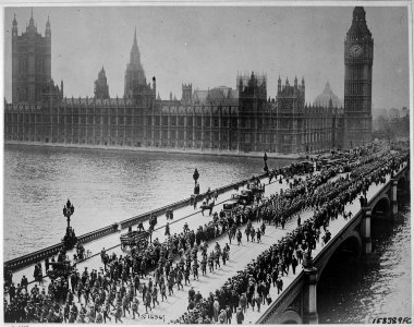 American troops on way to the front march thru London amid the plaudits of the multitudes, crossing Westminster... - NARA - 530734 photo