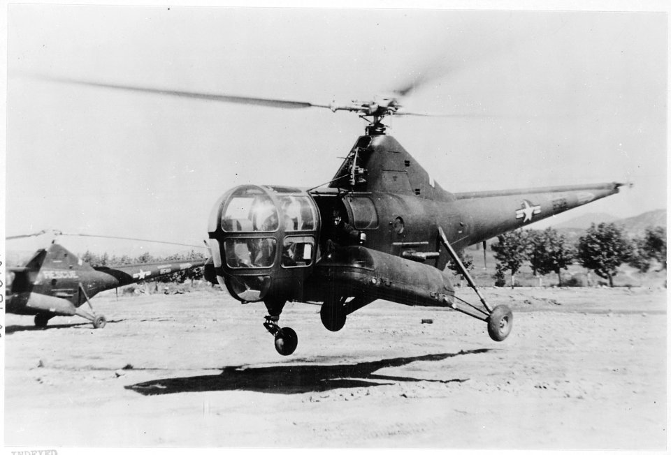 Airborne Mercy-Whole blood is administered to an airborne casualty, enclosed in a metal capsule attached to the... - NARA - 542317