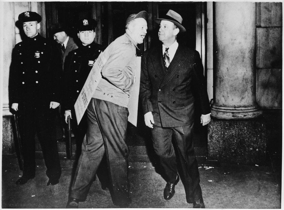 A member of the United Financial Employees, on strike in 1948, heckling a businessman who crossed the picket line, 1948 - NARA - 541914