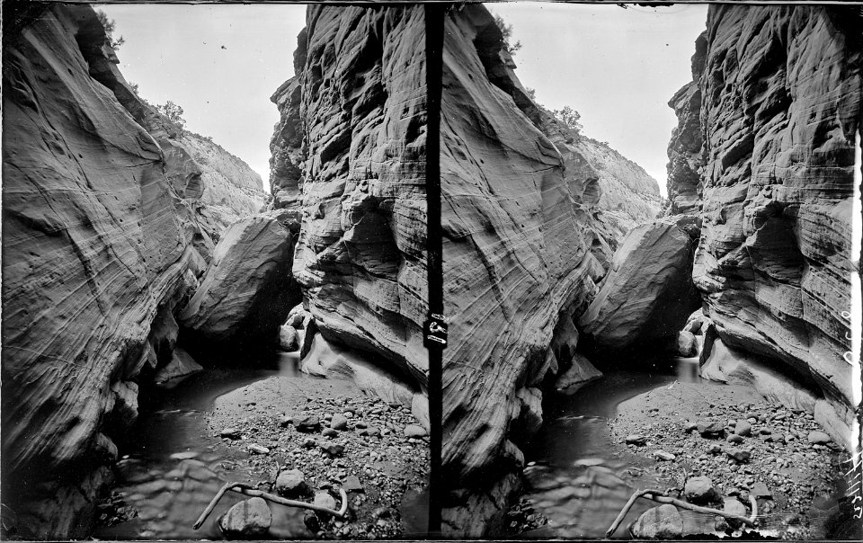 An Obstruction. Tantalus Creek, a boulder lodged between creek walls. Hillers photo. Old nos. 191, 411, 396, 835, 277. - NARA - 517974