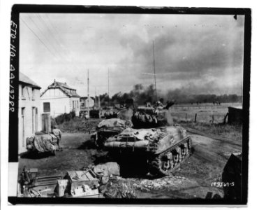 American Armor Fans Out Near Gelin, Belgium to Blast at Trapped German Infantry - NARA - 6003971