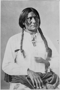 An Uainuint Paiute aiming a rifle, southwestern Utah, 1873 - NARA - 517730