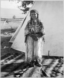 Angelic La Moose, whose grandfather was a Flathead chief, wearing costume her mother made, full-length, standing, in fro - NARA - 519156 photo