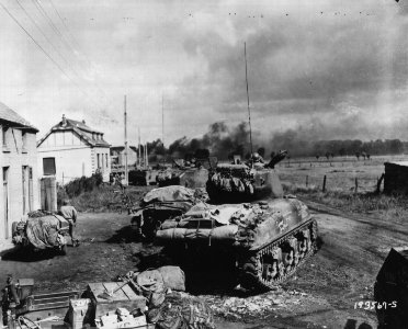 American Armor Fans Out Near Gelin, Belgium to Blast at Trapped German Infantry - NARA - 6003971 - cropped