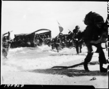 American troops of the 163rd Infantry Regiment, hit the beach from Higgins boats during the invasion of Wadke Island... - NARA - 531192