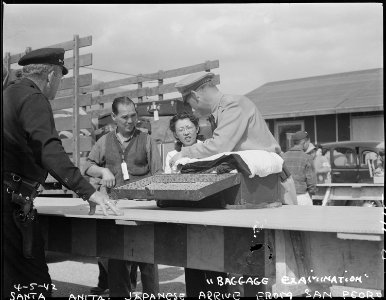 Arcadia, California. All baggage is inspected before newcomers enter Santa Anita assembly center fo . . . - NARA - 537041
