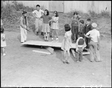 Arcadia, California. An impoverished ping pong table collapses in the midst of a game among youngst . . . - NARA - 537052