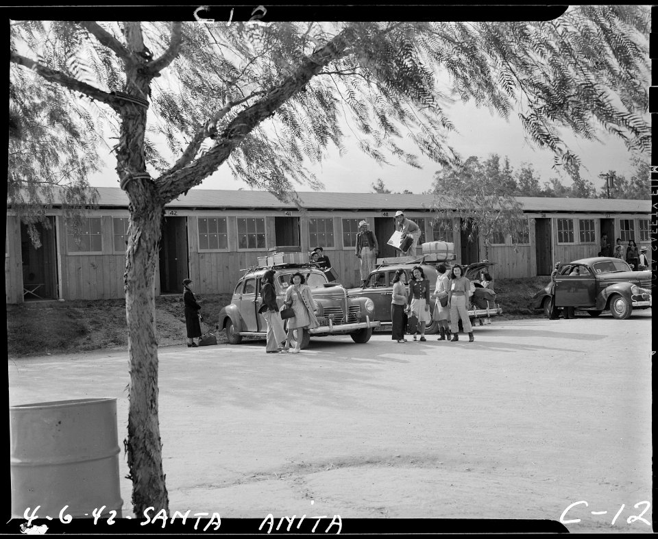 Arcadia, California. Evacuees of Japanese ancestry arriving at the Santa Anita Assembly center to a . . . - NARA - 537393
