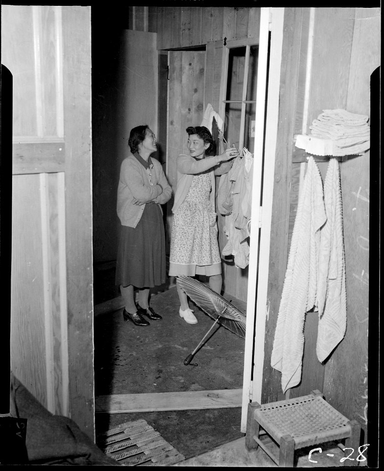 Arcadia, California. These evacuees of Japanese ancestry are shown in their barrack apartment. Lat . . . - NARA - 537409