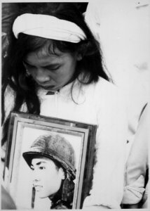 Almost 400 men, women and children massacred by the Viet Cong during Tet 1968 were mourned at a common-grave burial on - NARA - 541845 photo