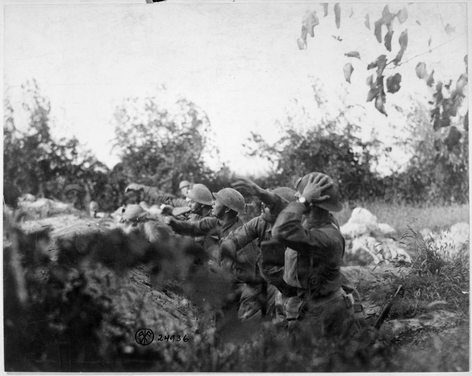 American soldiers on the Piave front hurling a shower of hand grenades into the Austrian trenches. Varage, Italy.... - NARA - 530761