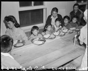 Arcadia, California. Meal time, cafeteria-style, for these children at Santa Anita assembly center . . . - NARA - 537029