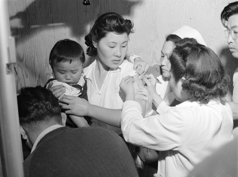 Arcadia, California. Evacuees of Japanese ancestry are being vaccinated by fellow evacuees upon arr . . . - NARA - 536005