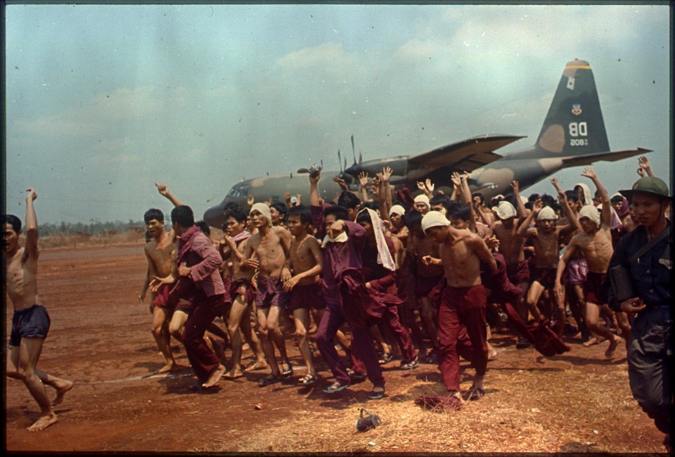 ARVN Prisoner of War Repatriation. Prisoners of War shed their prison uniforms and shout political slogans following... - NARA - 530631
