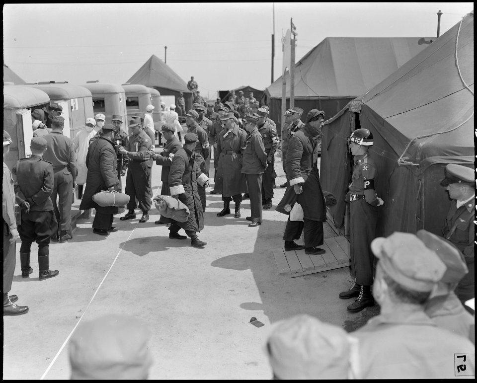 At Panmunjom, Korea, POW's (recently repatriated in the UN POW exchange) are off-loaded from ambulances. Note the... - NARA - 542188