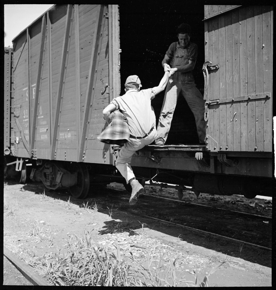 Bakersfield, California. On the Freights. Helping a newcomer hop a freight - NARA - 532069
