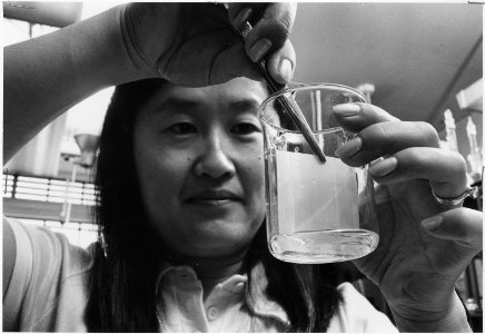 Berkeley, California. Chemist Ellen Lew conducts thin layer chromotography to identify the amino acids in a peptide... - NARA - 512805 photo