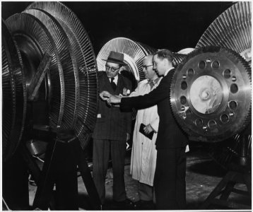 Belgium. Belgian electrical engineers Georges Jean L. Van Antro, left, Georges H. Marchal, center, and Jacques de... - NARA - 541661 photo