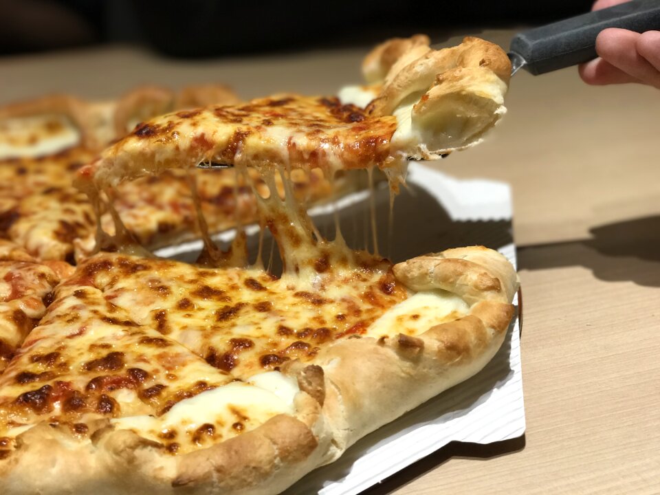 Hungry delicious brown pizza