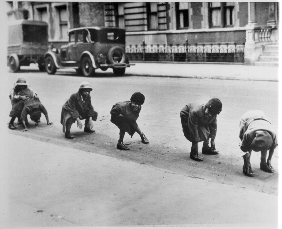 Black children playing leap frog in a Harlem street, ca. 1930 - NARA - 541880
